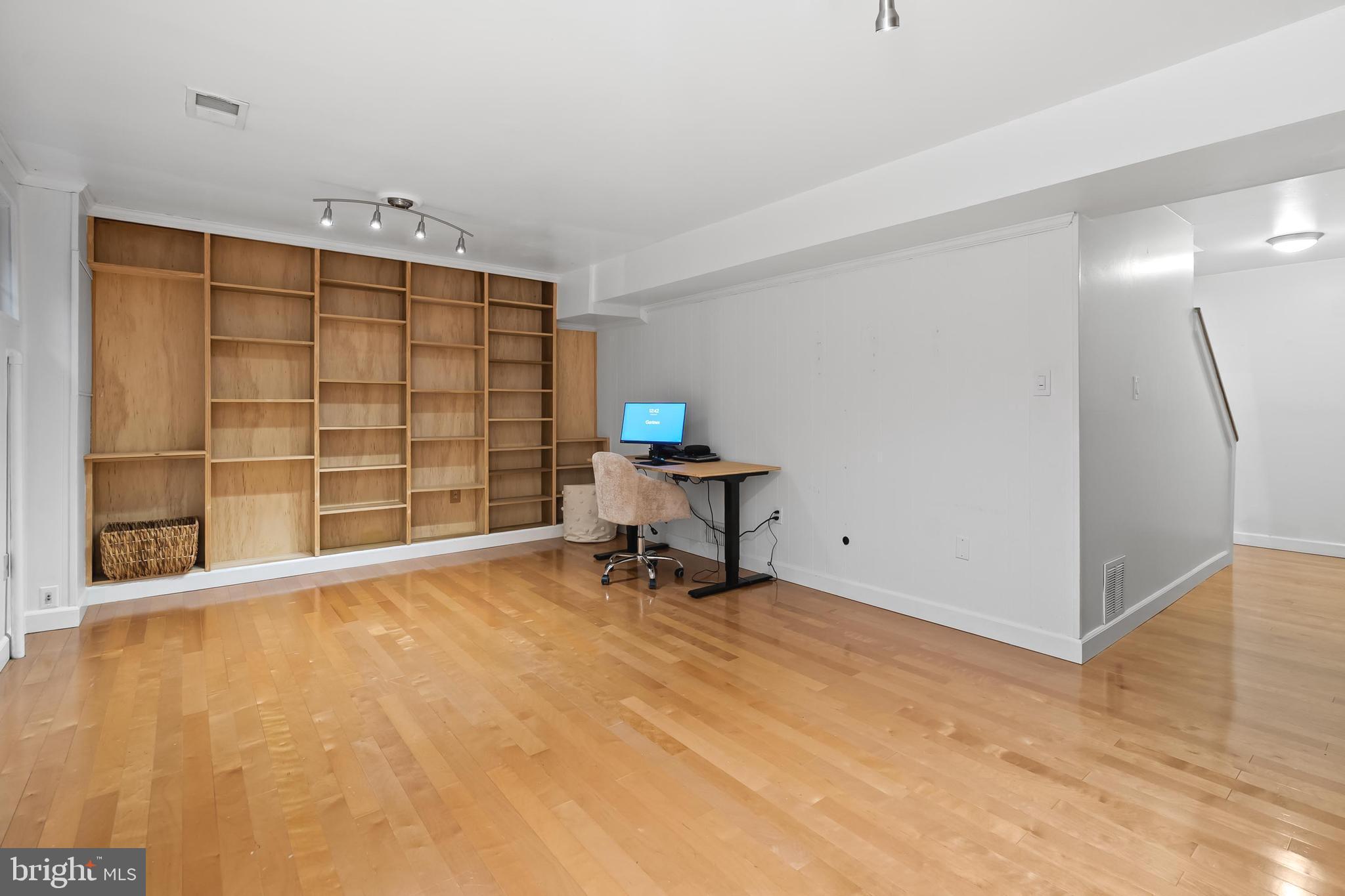 7029 Leewood Forest Drive Springfield, VA 22151 - Photo 32 of 45 a view of a workspace with furniture and a window