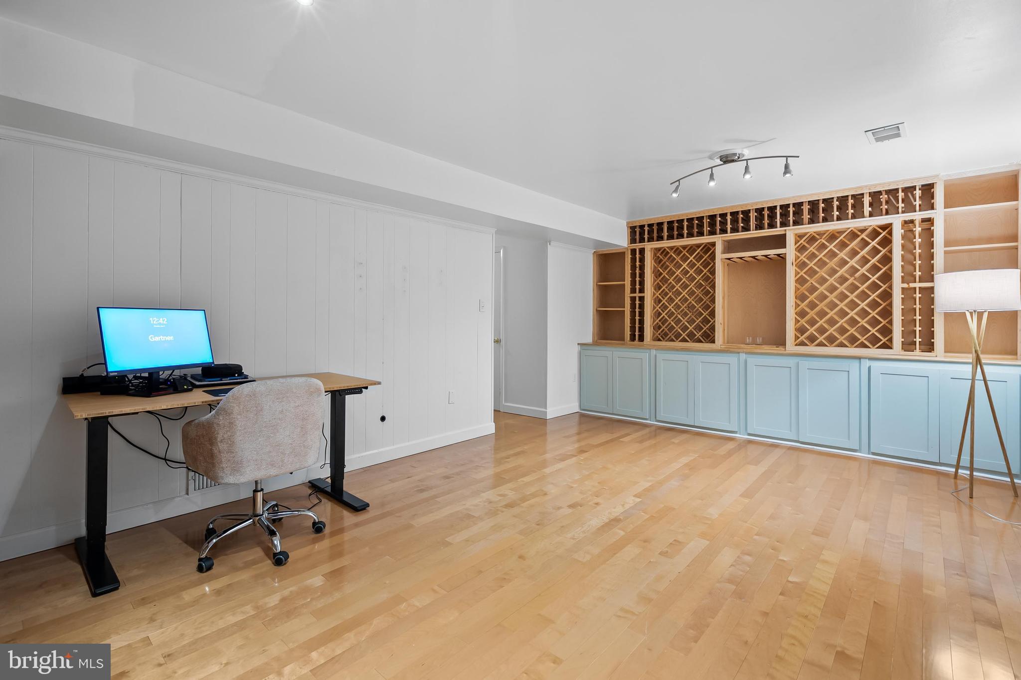 7029 Leewood Forest Drive Springfield, VA 22151 - Photo 33 of 45 a view of workspace with wooden floor and windows