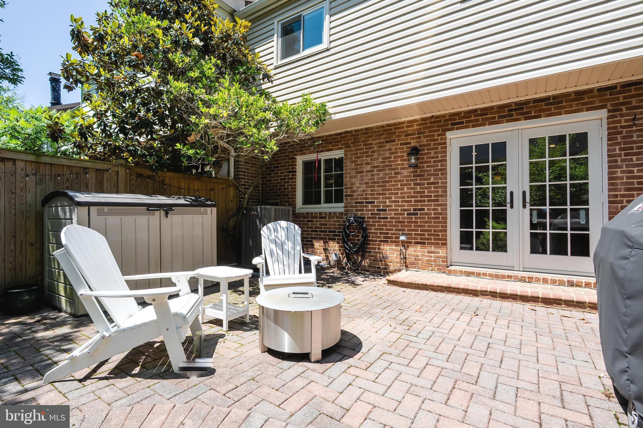 7029 Leewood Forest Drive Springfield, VA 22151 - Photo 36 of 45 a view of a patio with table and chairs and wooden fence