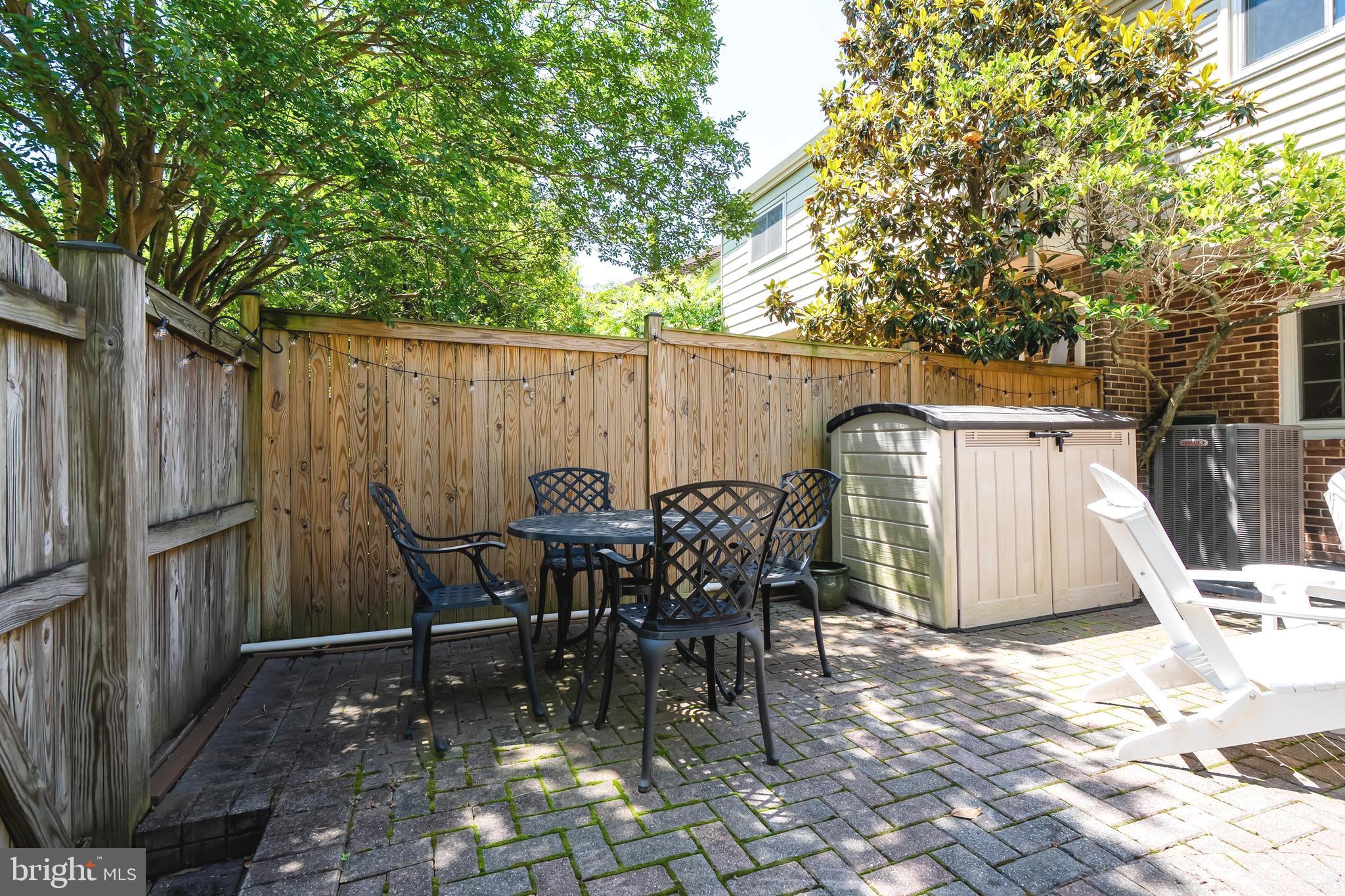 7029 Leewood Forest Drive Springfield, VA 22151 - Photo 39 of 45 a view of a dinning table and chairs in patio