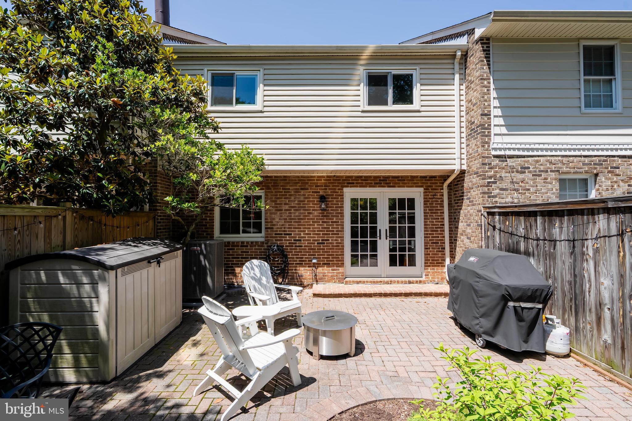 7029 Leewood Forest Drive Springfield, VA 22151 - Photo 40 of 45 a view of a patio with couple of chairs and a fire pit