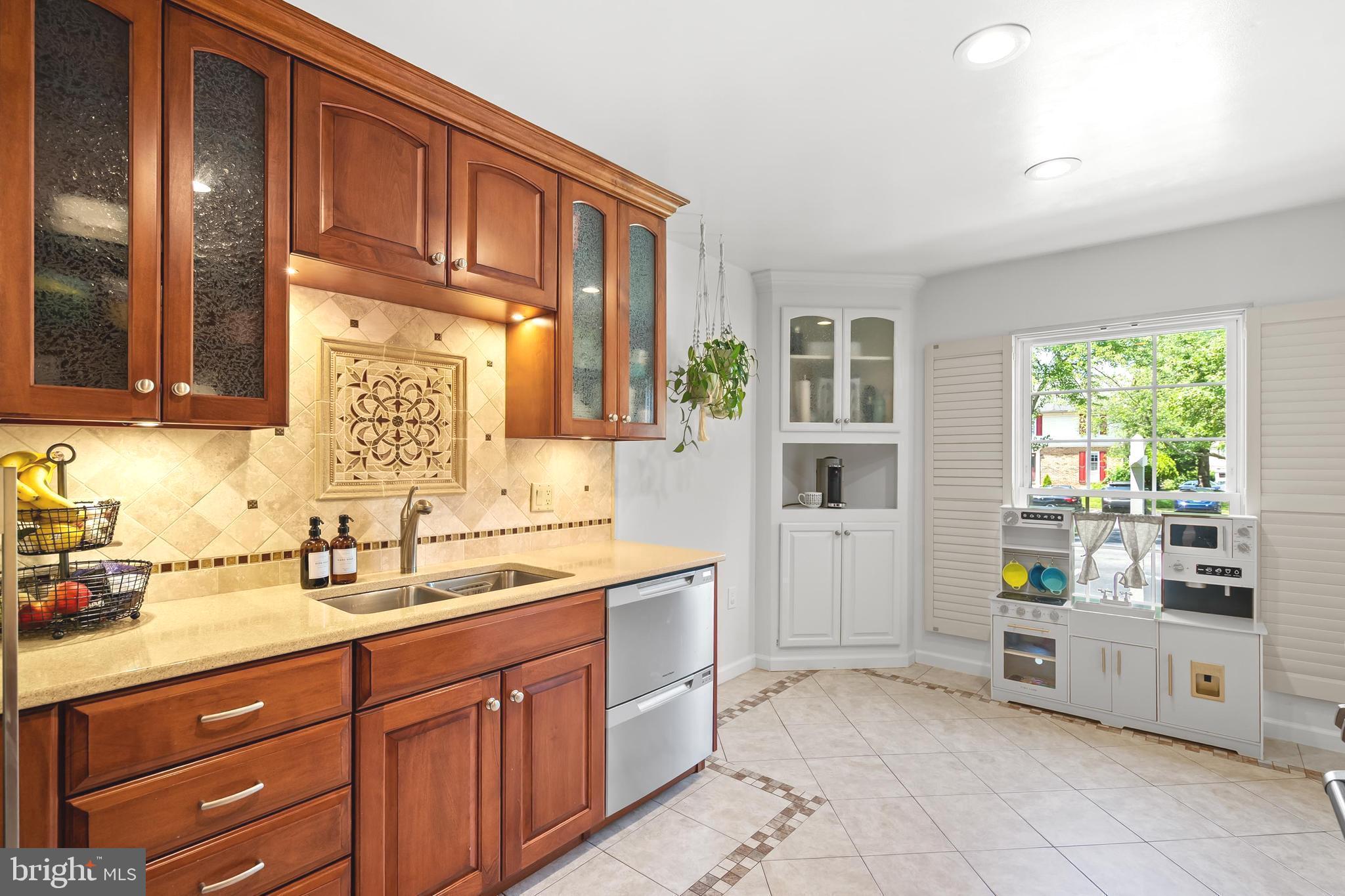 7029 Leewood Forest Drive Springfield, VA 22151 - Photo 7 of 45 a kitchen with cabinets and window