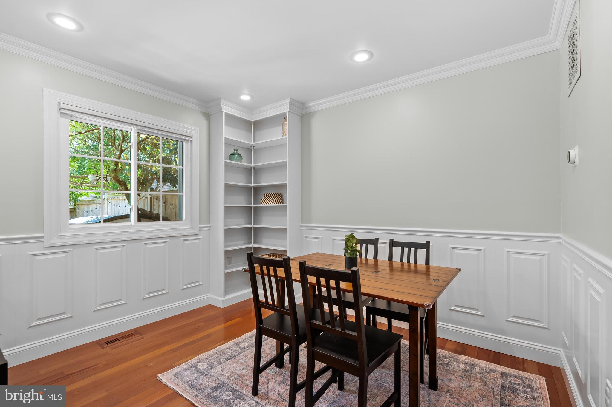 7029 Leewood Forest Drive Springfield, VA 22151 - Photo 10 of 45 a view of a dining room with furniture and wooden floor