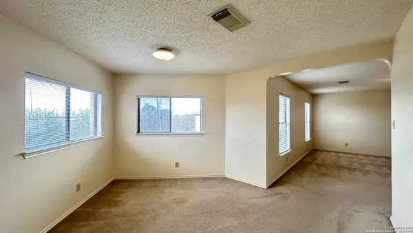 an empty room with windows