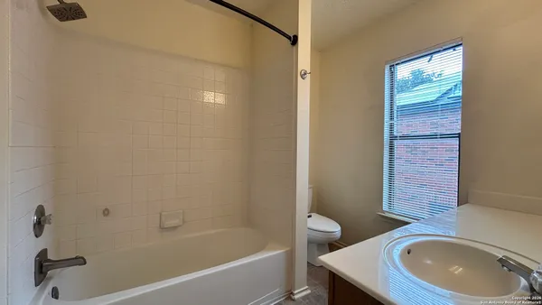 a bathroom with a sink a bathtub and a toilet