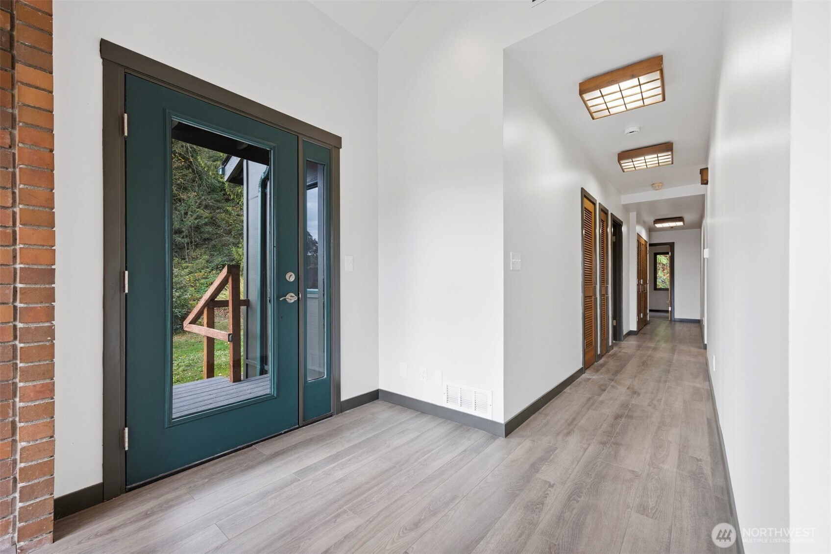 18928 Bow Hill Road Burlington, WA 98233 - Photo 13 of 39 a view of a hallway with wooden floor and entryway