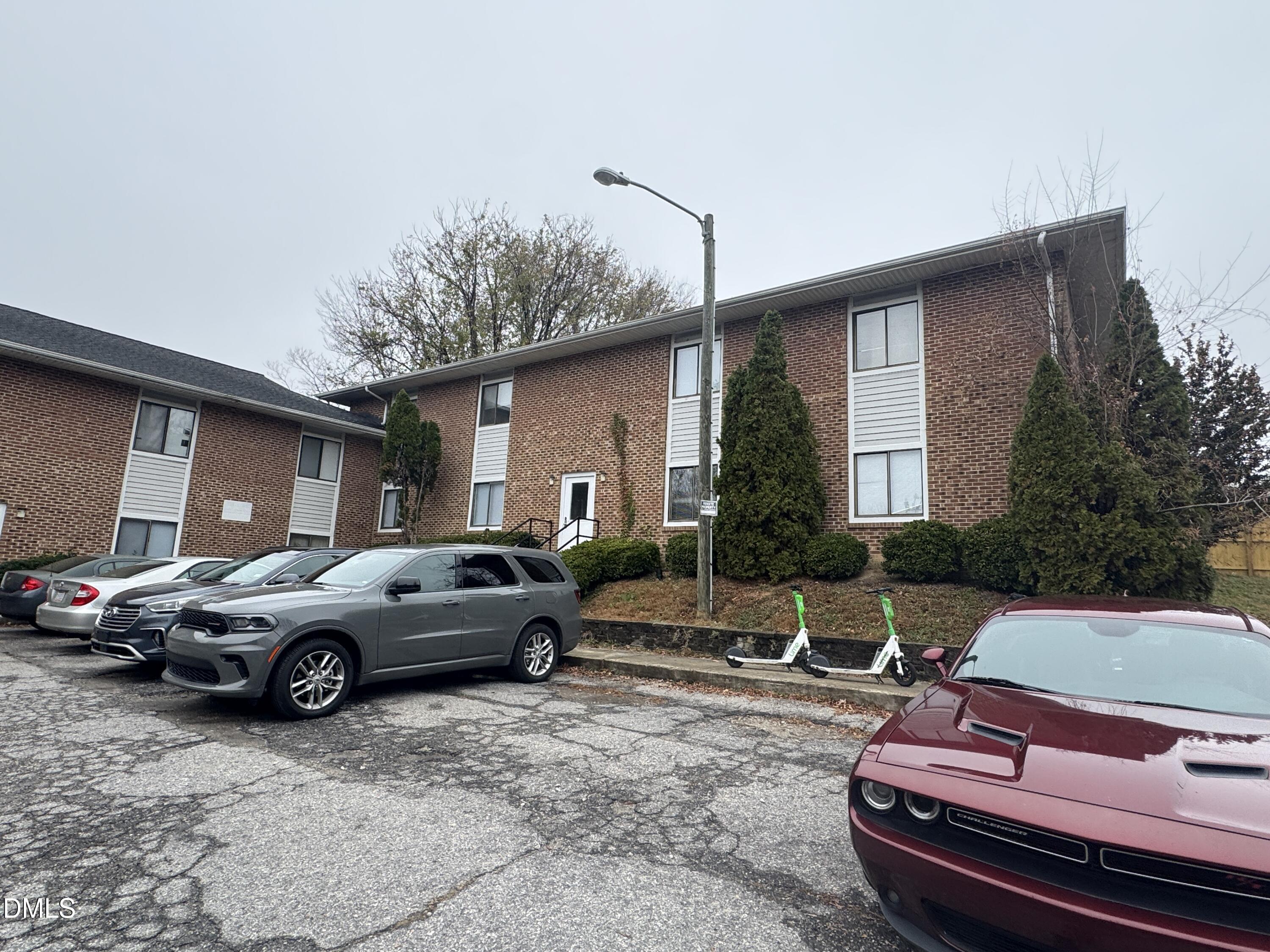 a view of a car parked front of a house