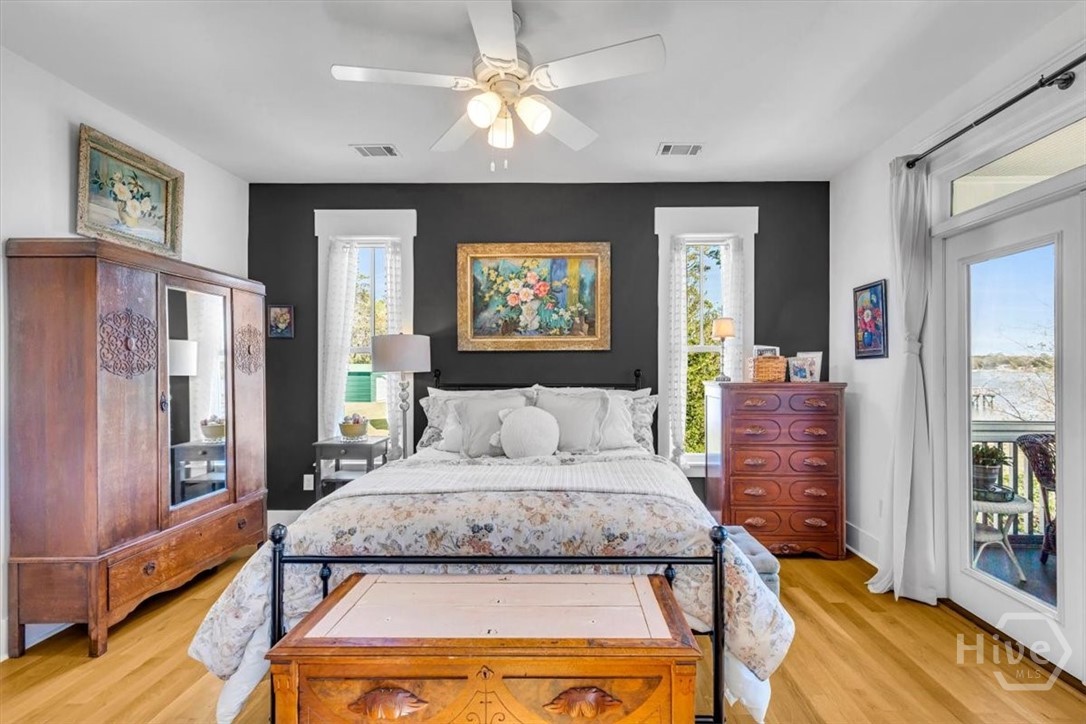 690 Japonica Road Midway, GA 31320 - Photo 18 of 70 Primary suite with attached bath and doors that open onto the screen porch.