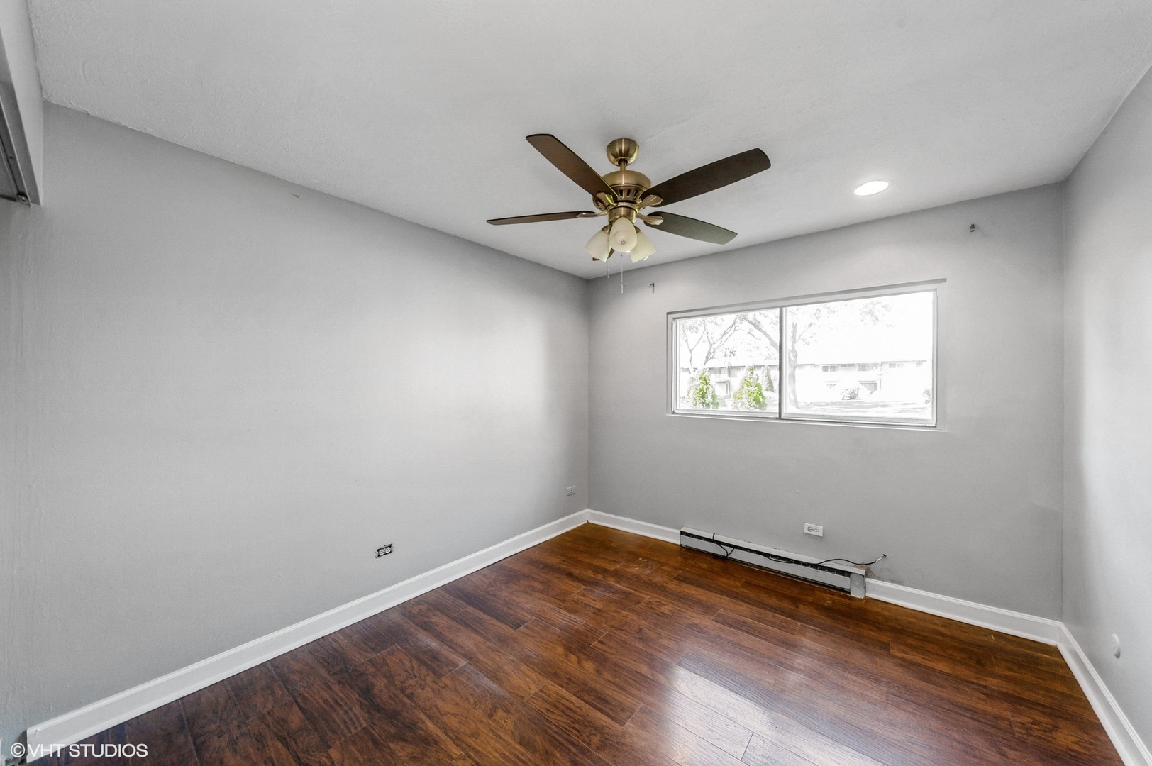 880 East Old Willow Road, Unit 175 Prospect Heights, IL 60070 - Photo 9 of 12 a view of a big room with wooden floor and windows