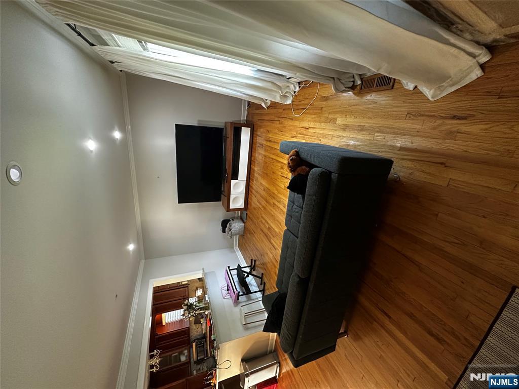 4 Rea Ave Extension, Unit 1 Hawthorne, NJ 07506 - Photo 2 of 18 a room with furniture and flat screen tv