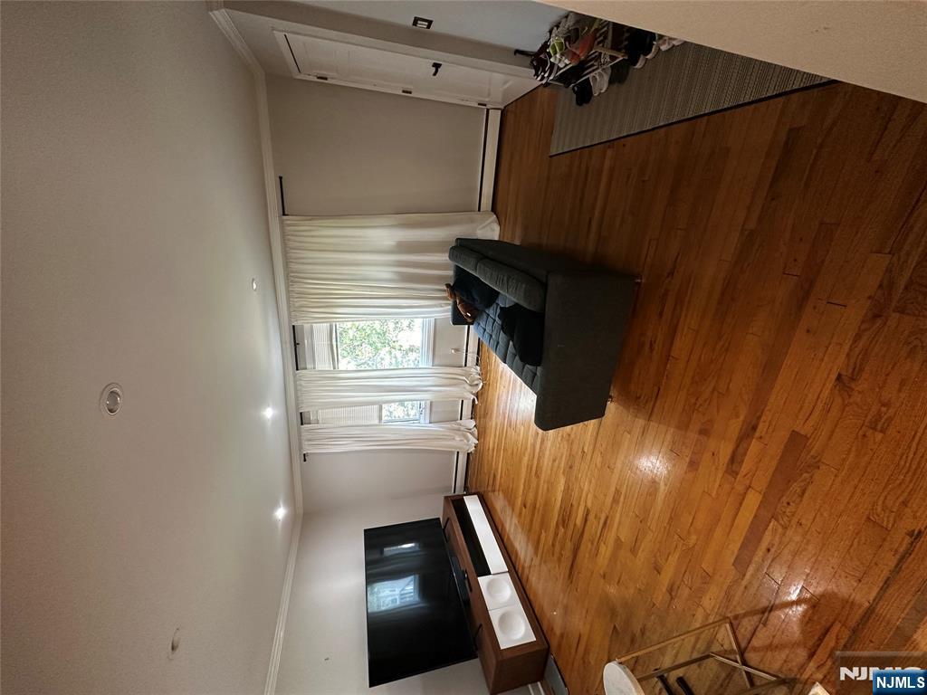 4 Rea Ave Extension, Unit 1 Hawthorne, NJ 07506 - Photo 3 of 18 a living room with furniture and a flat screen tv