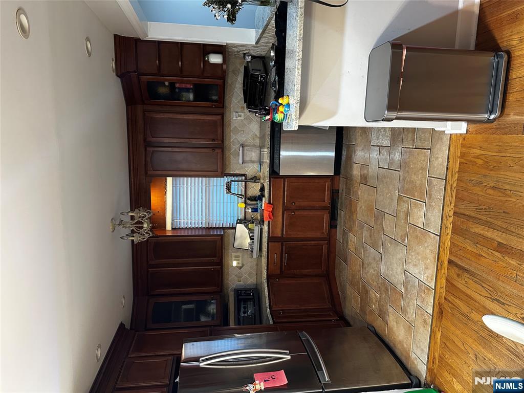 4 Rea Ave Extension, Unit 1 Hawthorne, NJ 07506 - Photo 5 of 18 a kitchen with granite countertop a sink cabinets and stainless steel appliances