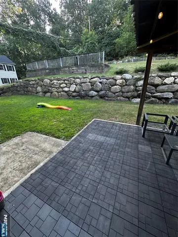 a view of a park with large trees