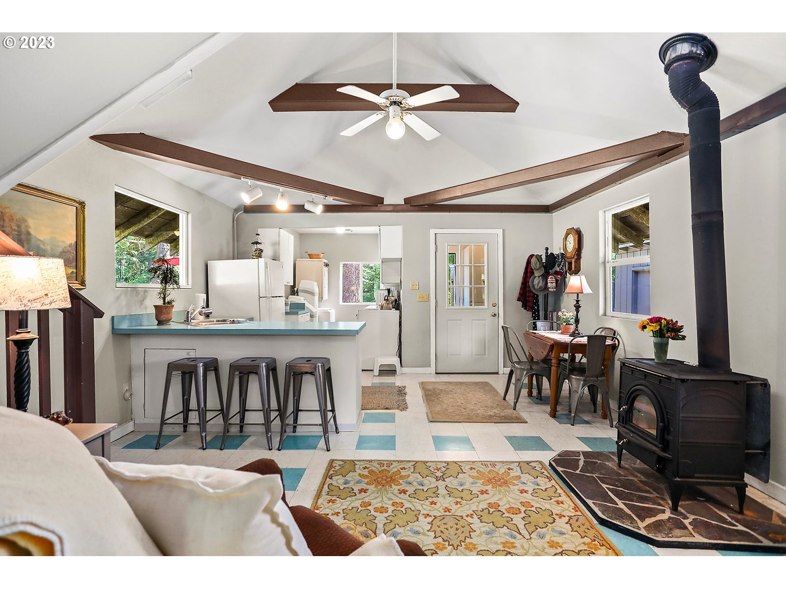 21 Prairie Road Appleton, WA 98602 - Photo 19 of 39 a living room with furniture a dining table and chairs with wooden floor
