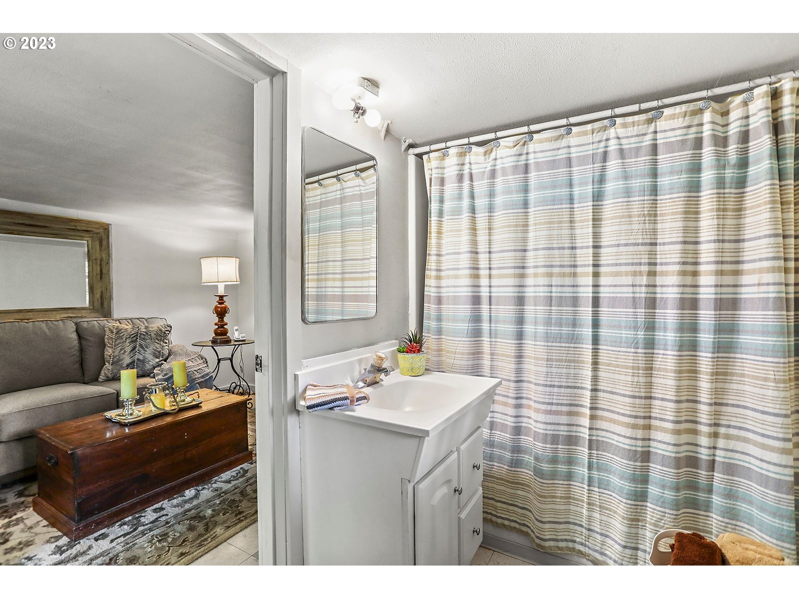 21 Prairie Road Appleton, WA 98602 - Photo 29 of 39 a bathroom with a sink vanity granite and a mirror
