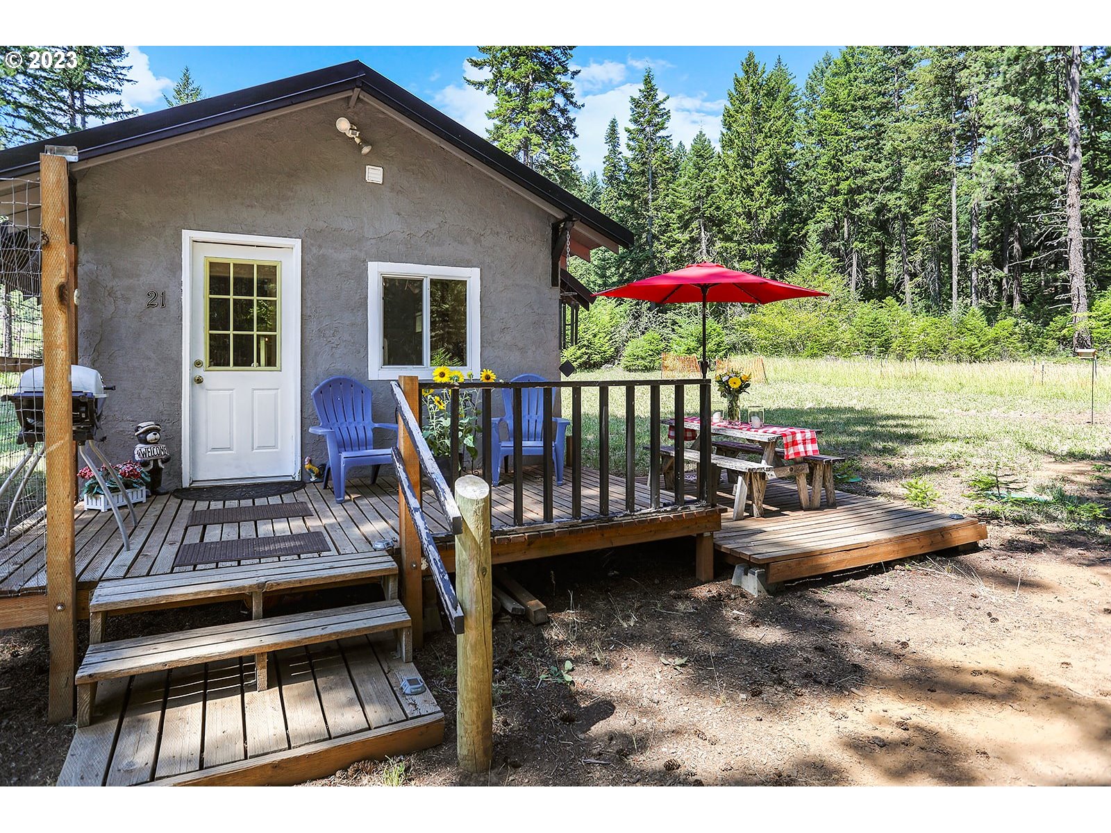 21 Prairie Road Appleton, WA 98602 - Photo 4 of 39 a view of a roof deck with table and chairs