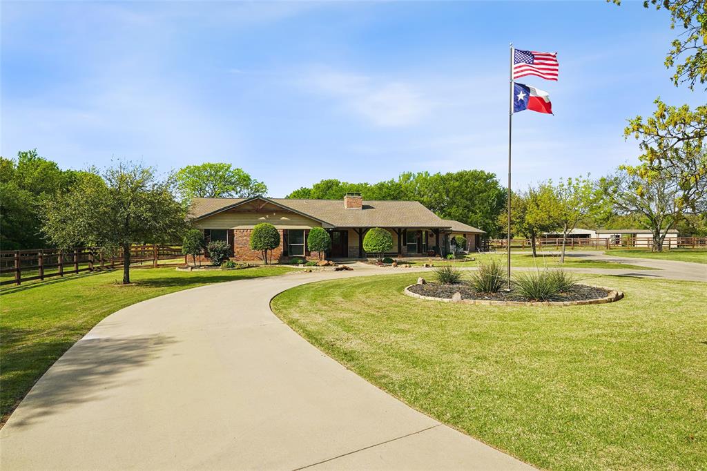 1006 Cochran Road Argyle, TX 76226 - Photo 5 of 40 a front view of a house with swimming pool