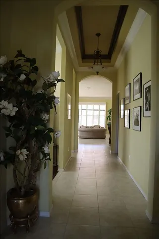 a view of entryway and hall with a chair