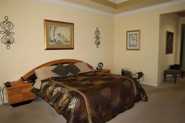 a bed room with a bed and a chair