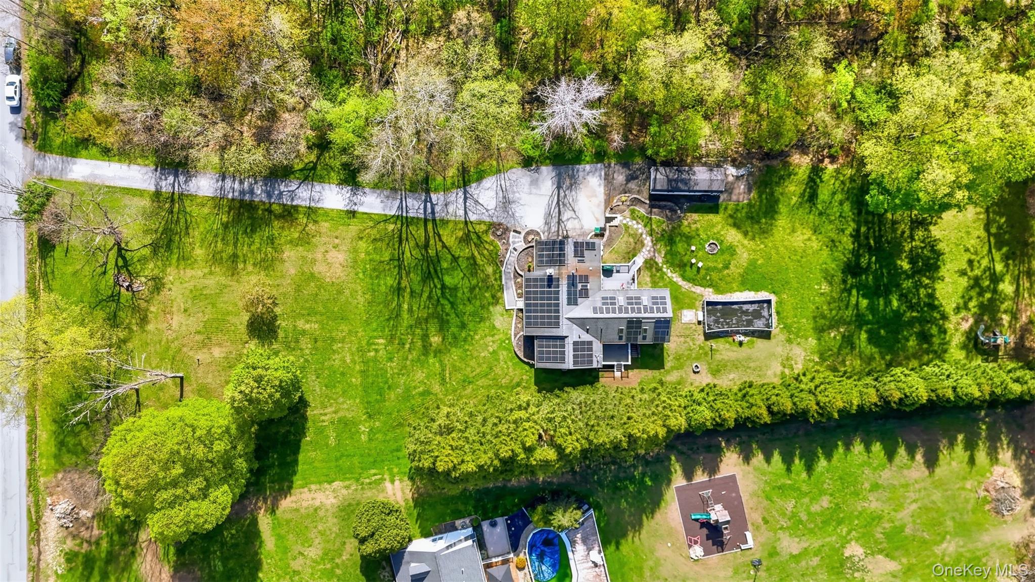 65 Judson Road Montgomery, NY 12549 - Photo 5 of 41 an aerial view of residential houses with outdoor space and swimming pool