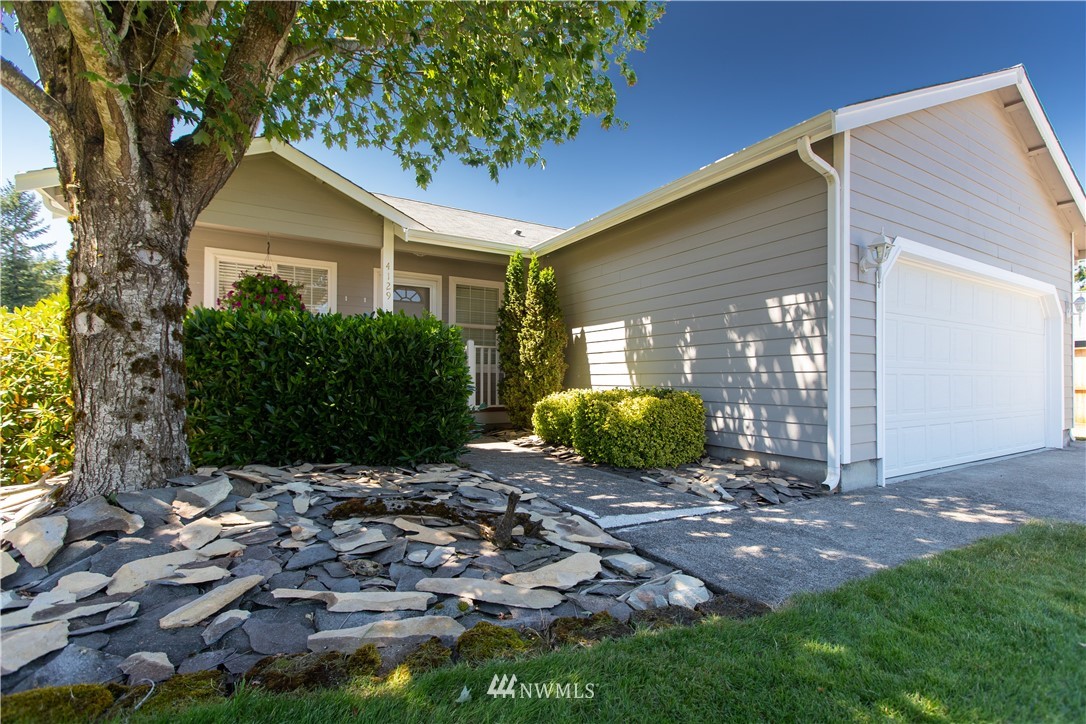 4129 Coomer Lane Southwest Rochester, WA 98579 - Photo 1 of 31 a view of a backyard with plants and large trees