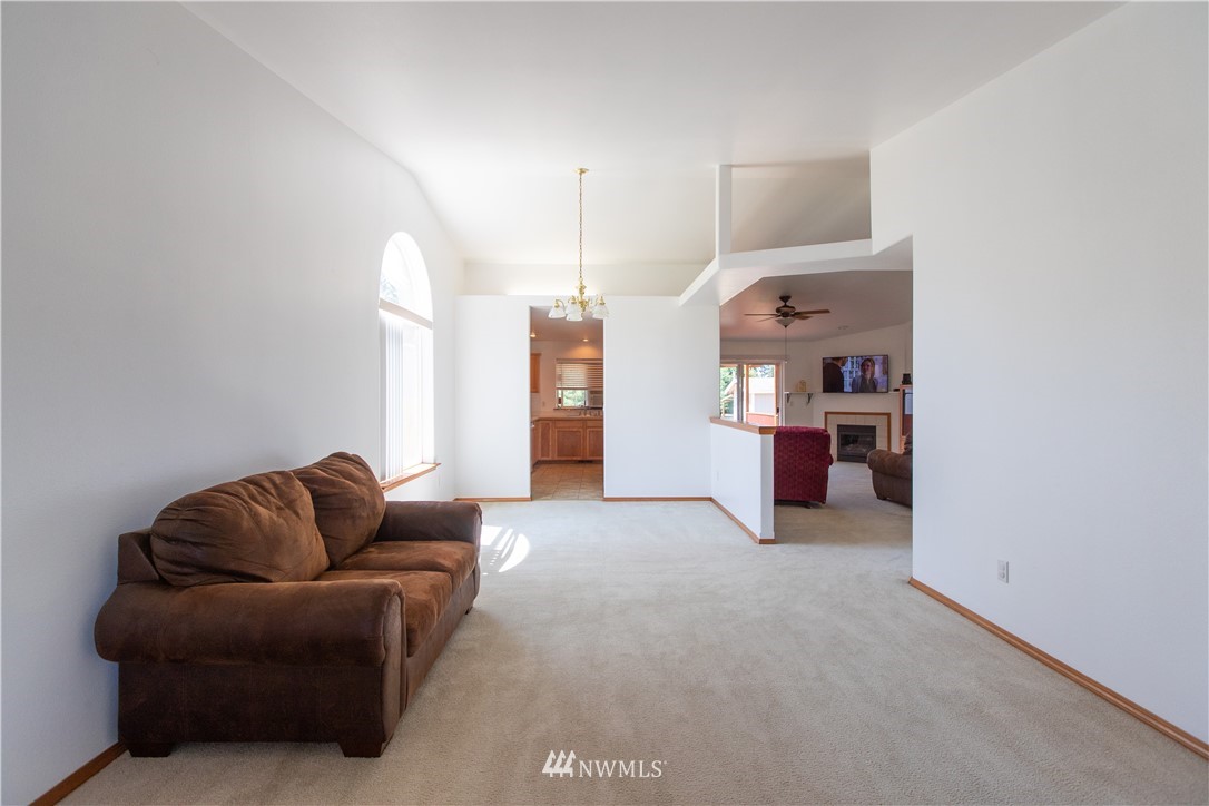4129 Coomer Lane Southwest Rochester, WA 98579 - Photo 21 of 31 a living room with furniture and a couch
