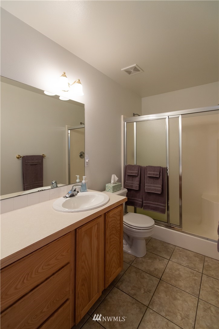 4129 Coomer Lane Southwest Rochester, WA 98579 - Photo 26 of 31 a bathroom with a sink a toilet and shower
