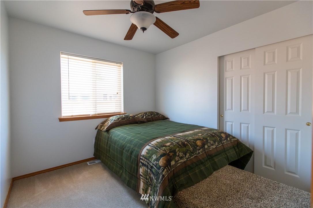 4129 Coomer Lane Southwest Rochester, WA 98579 - Photo 28 of 31 a bedroom with a bed and window