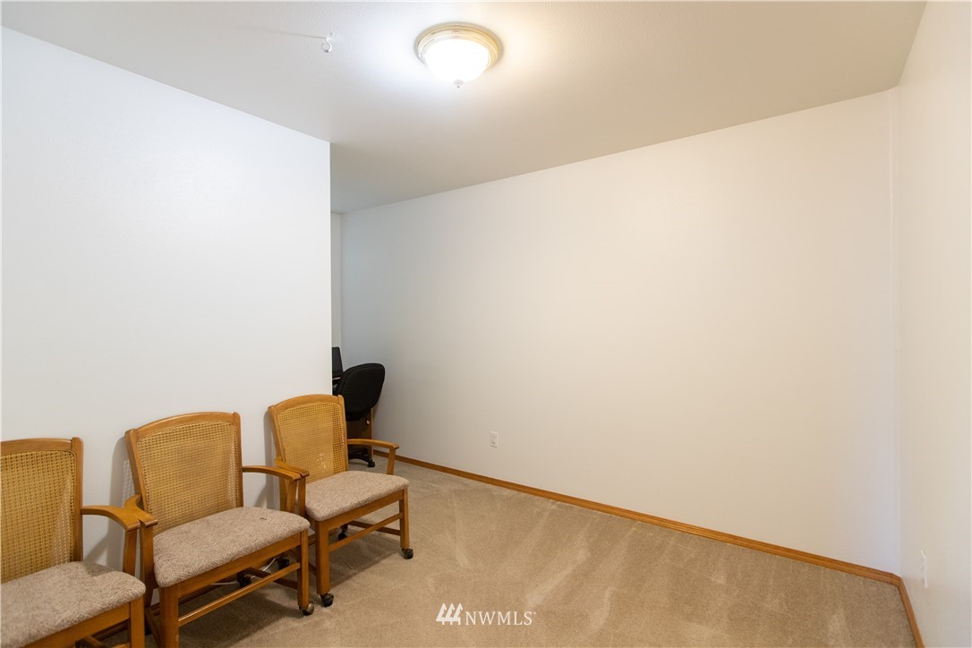 4129 Coomer Lane Southwest Rochester, WA 98579 - Photo 29 of 31 a chair and a table in a room