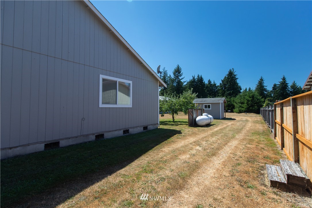 4129 Coomer Lane Southwest Rochester, WA 98579 - Photo 9 of 31 a view of a house with backyard and sitting area