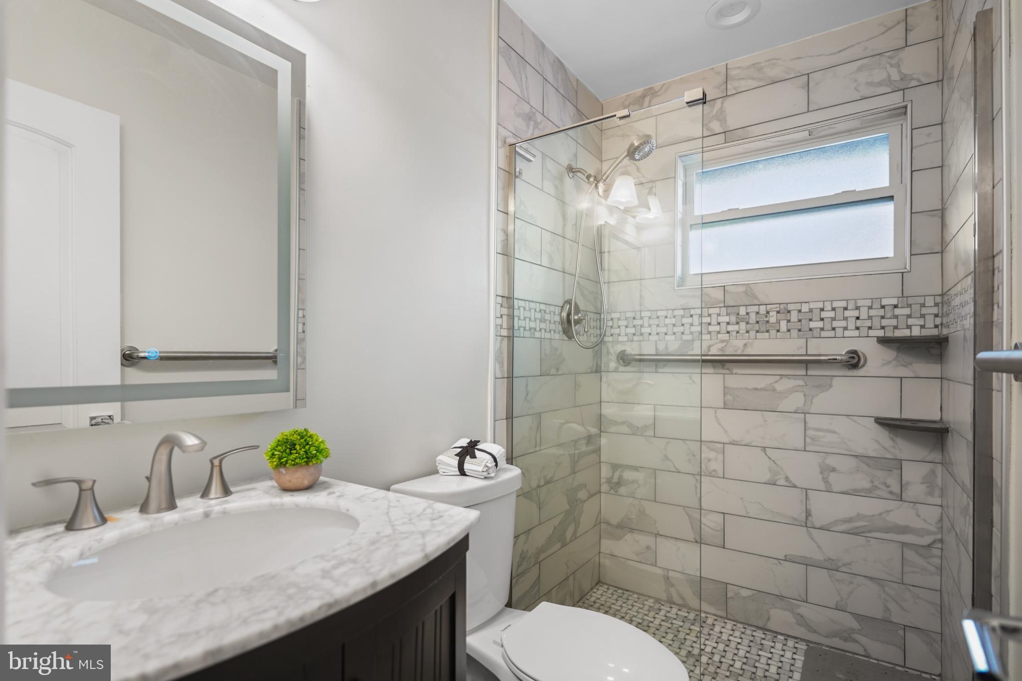 1790 Verbena Street Northwest Washington, DC 20012 - Photo 16 of 31 a bathroom with a sink toilet and shower
