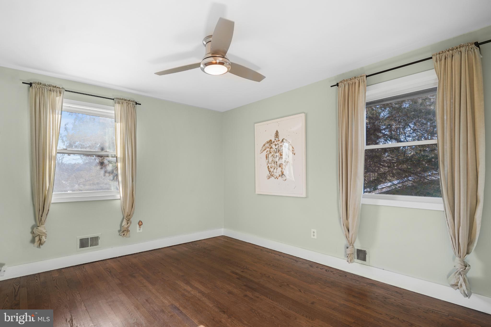 1790 Verbena Street Northwest Washington, DC 20012 - Photo 18 of 31 wooden floor in an empty room with a window