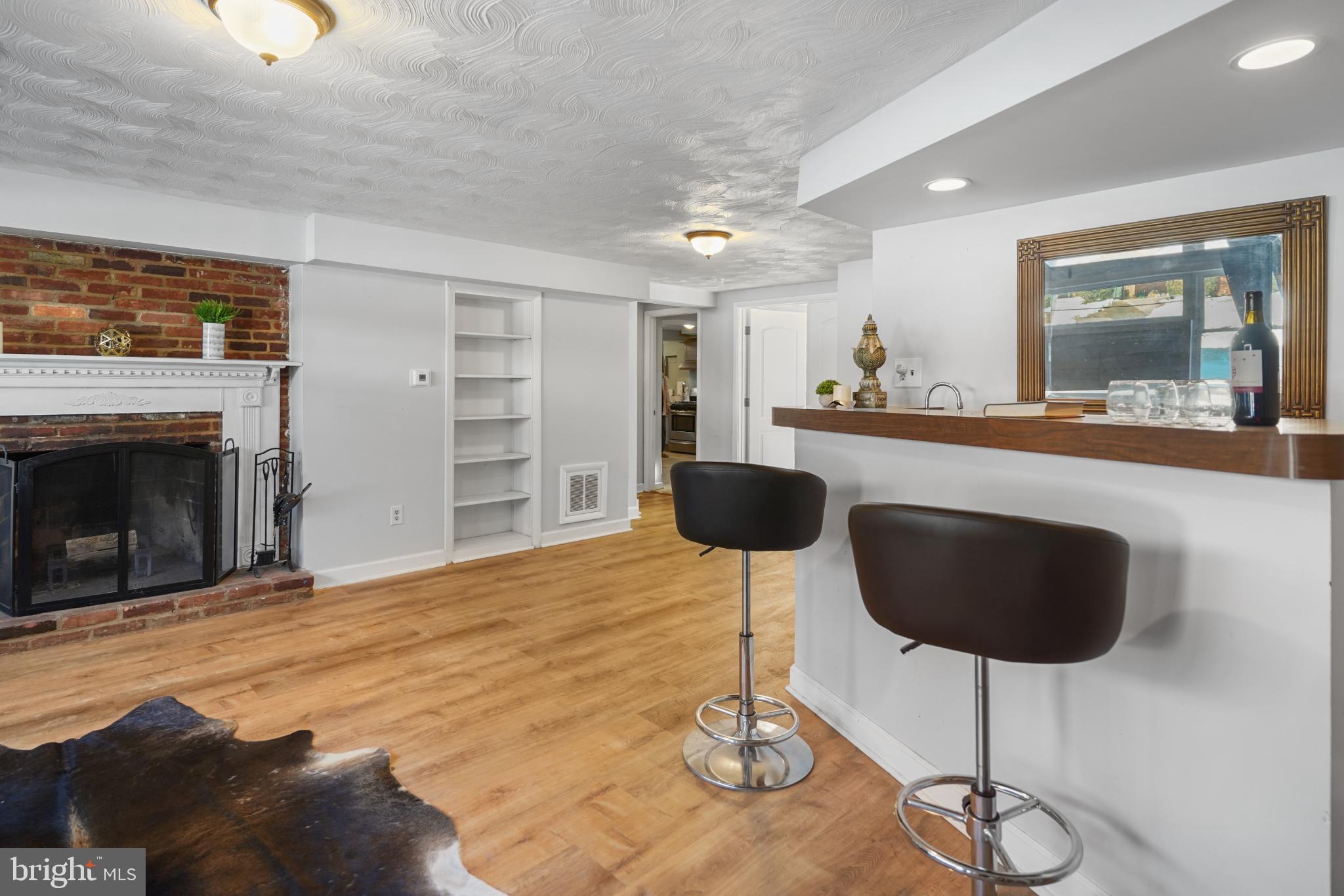 1790 Verbena Street Northwest Washington, DC 20012 - Photo 25 of 31 a kitchen with a cabinets and chandelier