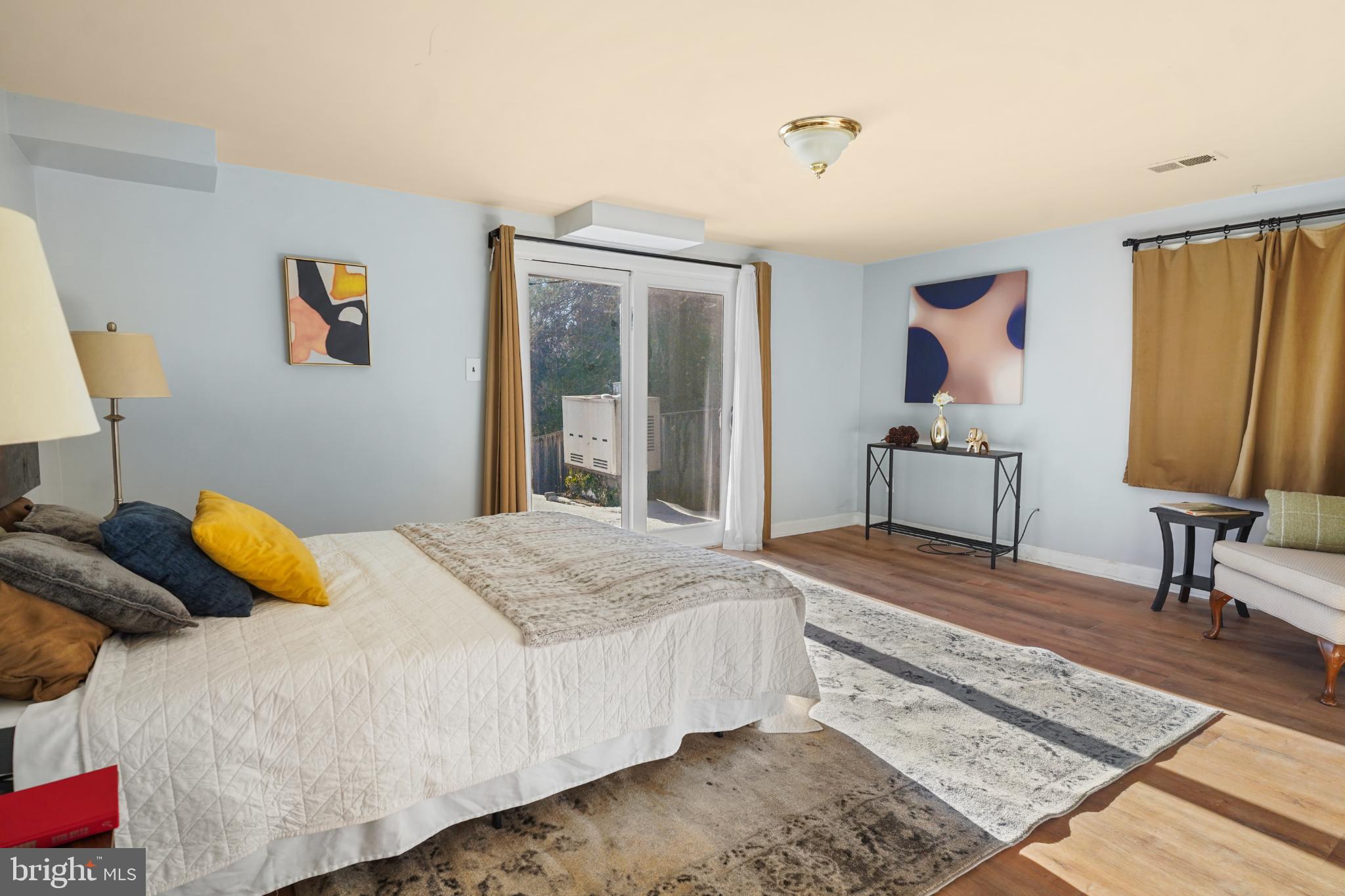 1790 Verbena Street Northwest Washington, DC 20012 - Photo 27 of 31 a bedroom with a bed and a chandelier