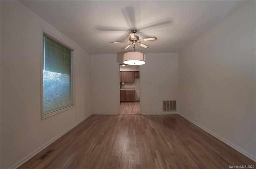 5220 Rounding Run Road, Unit 159 Charlotte, NC 28277 - Photo 23 of 42 wooden floor in an empty room with a window