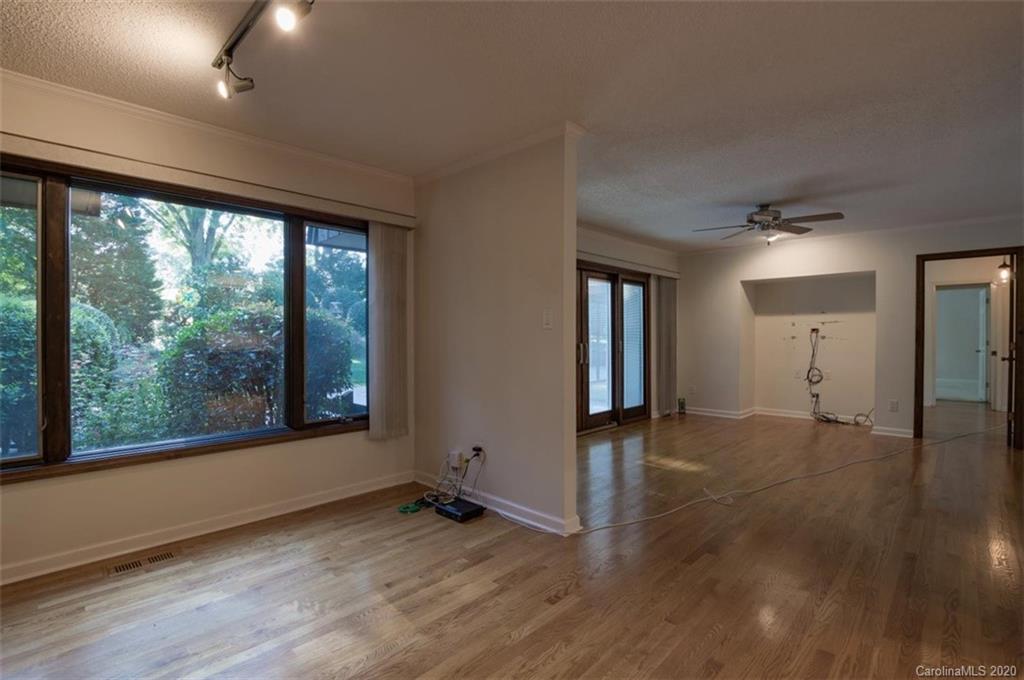 5220 Rounding Run Road, Unit 159 Charlotte, NC 28277 - Photo 40 of 42 a view of empty room with wooden floor and fan