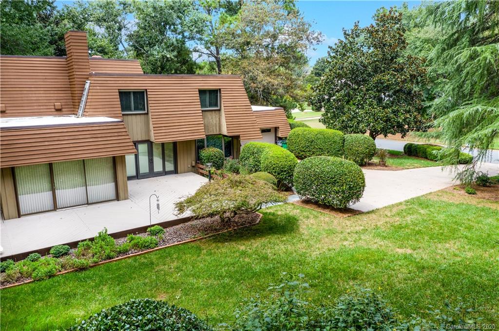 5220 Rounding Run Road, Unit 159 Charlotte, NC 28277 - Photo 7 of 42 a front view of a house with a yard and trees