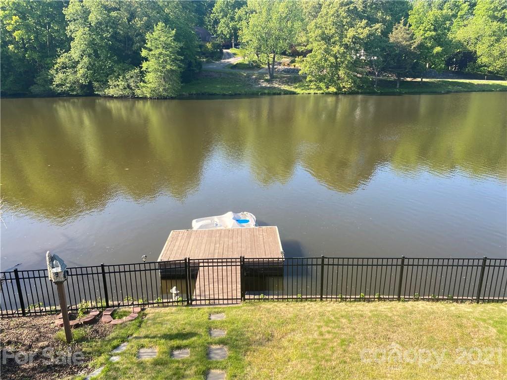 916 Ashford Way Fort Mill, SC 29708 - Photo 6 of 15 a view of a house with a backyard and a lake view
