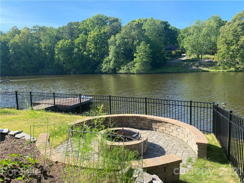 916 Ashford Way Fort Mill, SC 29708 - Photo 7 of 15 a view of a swimming pool with a lake view