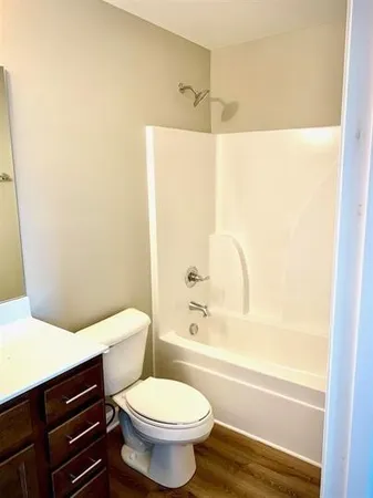 a bathroom with a sink a toilet and a bathtub