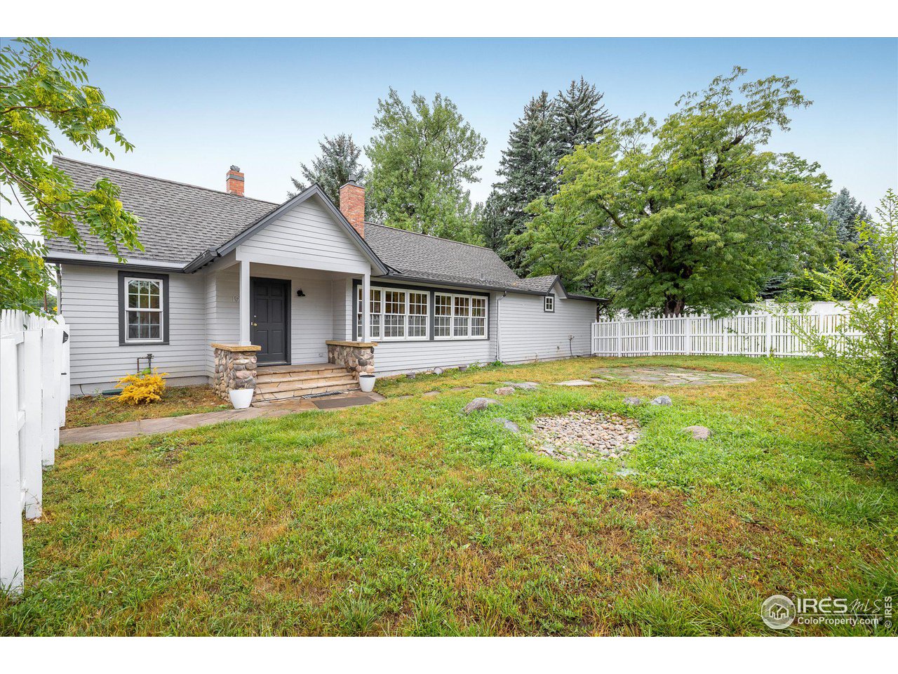 1928 Baseline Road Boulder, CO 80302 - Photo 5 of 5 a front view of a house with swimming pool having outdoor seating