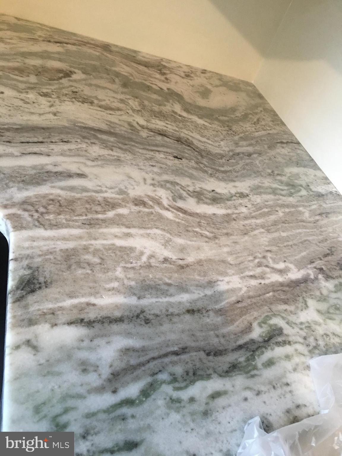 1 Pennsylvania Road, Unit 8 Glassboro, NJ 08028 - Photo 19 of 37 a view of a dry yard in front of the wall