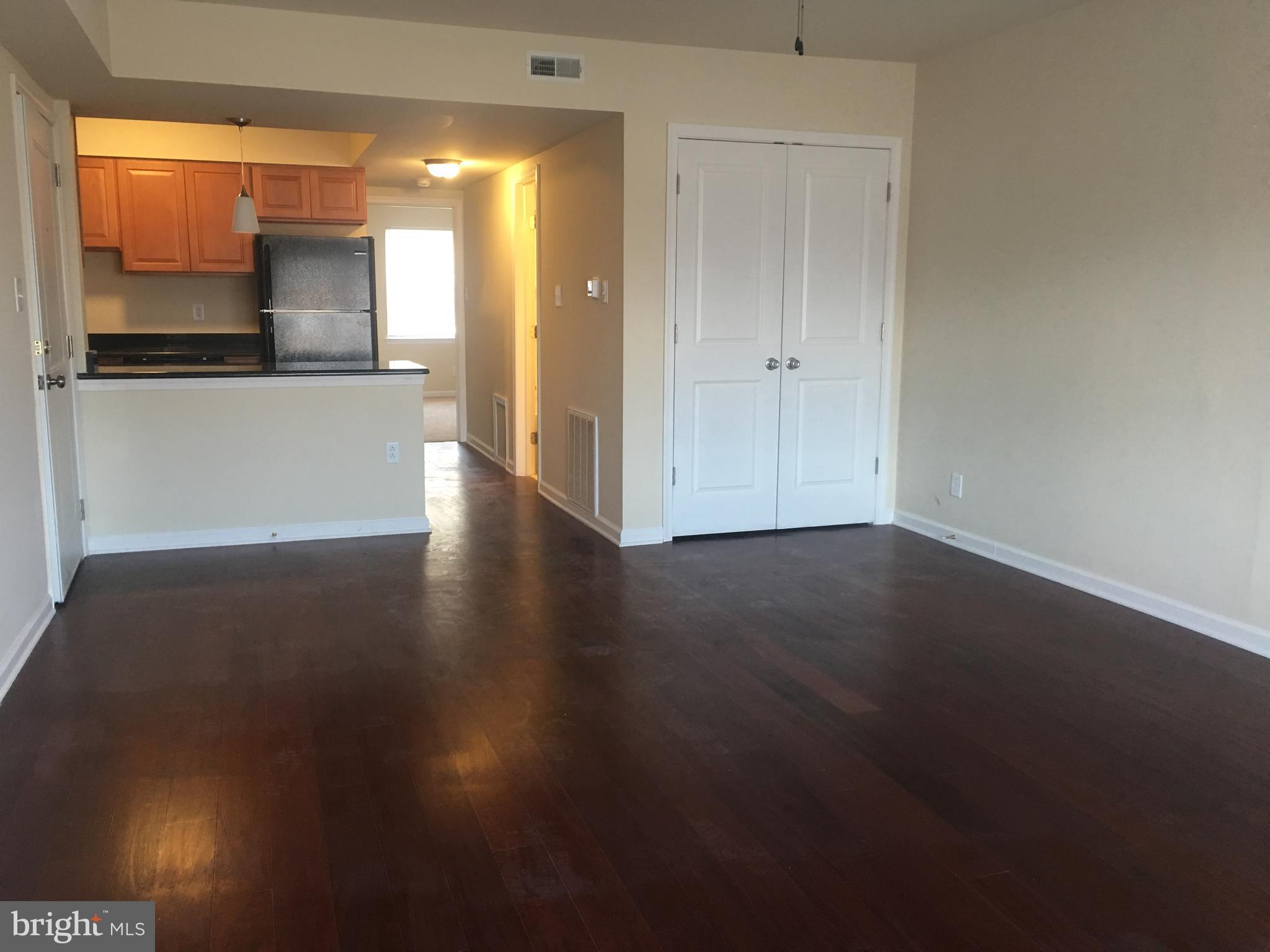 1 Pennsylvania Road, Unit 8 Glassboro, NJ 08028 - Photo 33 of 37 a view of a kitchen with wooden floor and a kitchen