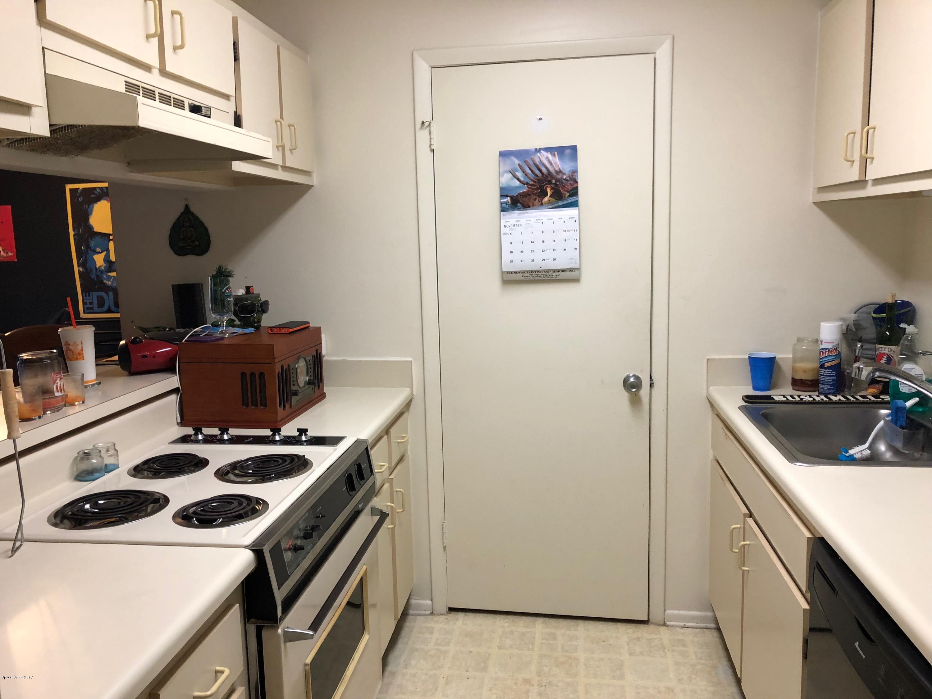 225 South Tropical Trail, Unit 515 Merritt Island, FL 32952 - Photo 3 of 11 Door to Laundry