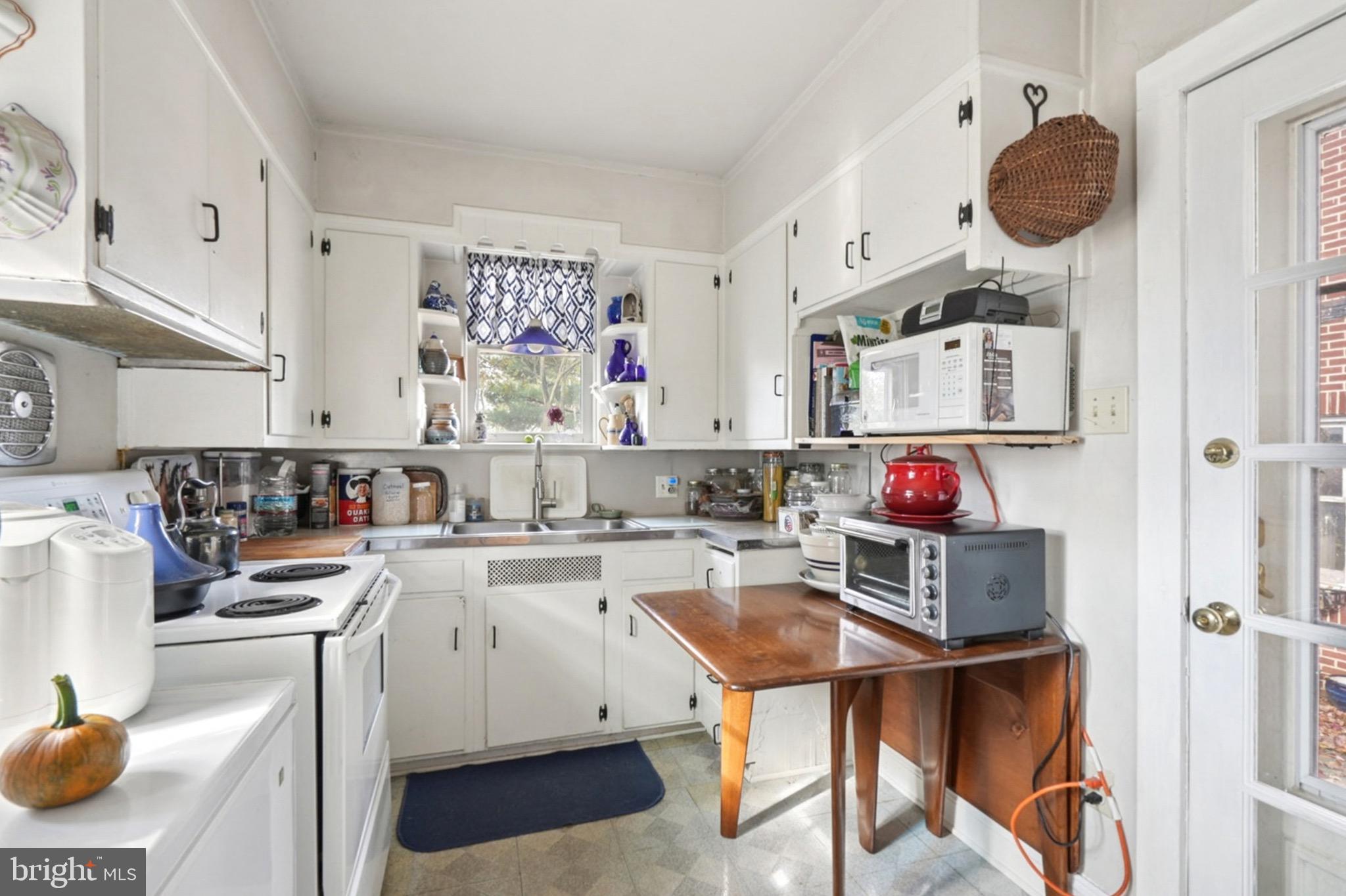 149 Highway 45 Mannington, NJ 08079 - Photo 13 of 24 a kitchen with a sink and a stove top oven