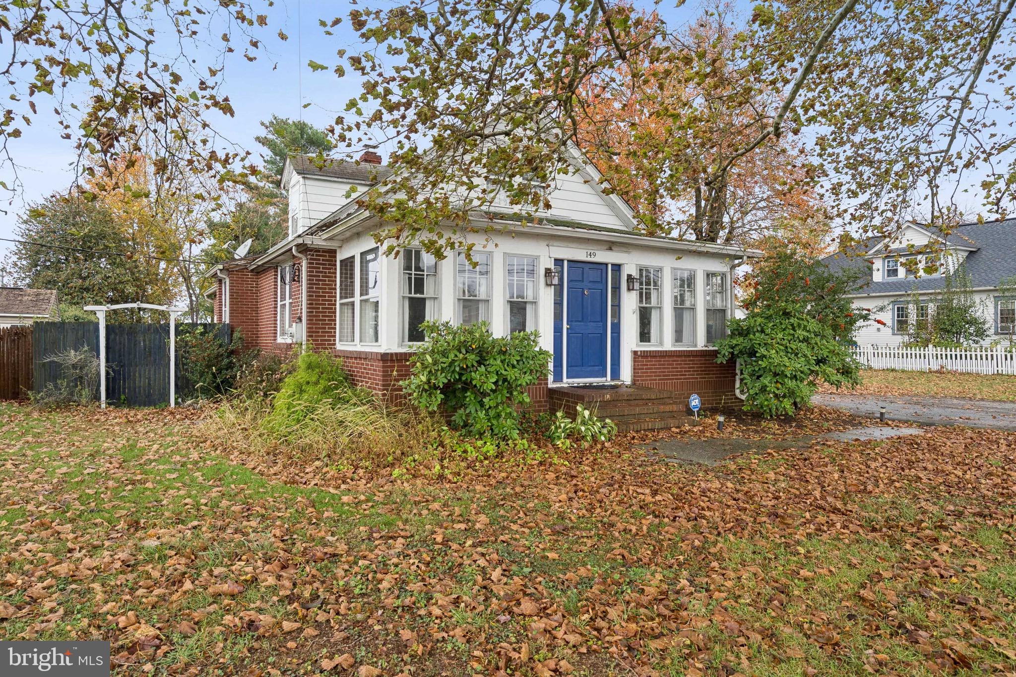 149 Highway 45 Mannington, NJ 08079 - Photo 2 of 24 a front view of a house with a garden