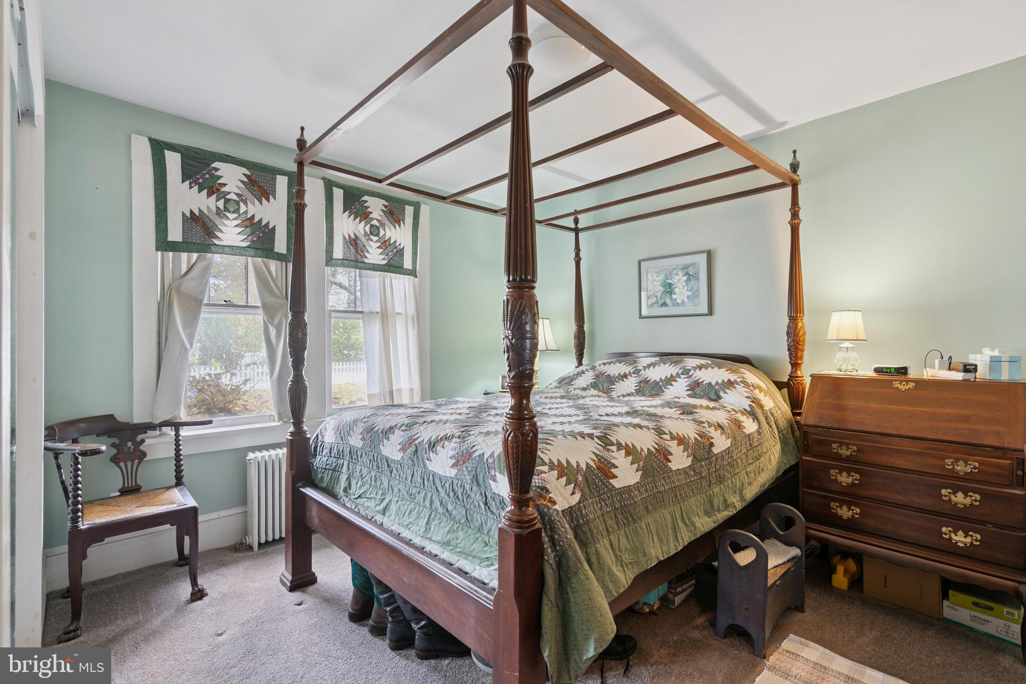 149 Highway 45 Mannington, NJ 08079 - Photo 9 of 24 a bed sitting in a bedroom next to a window