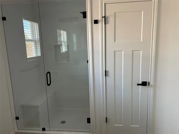 a room with a sink and a mirror