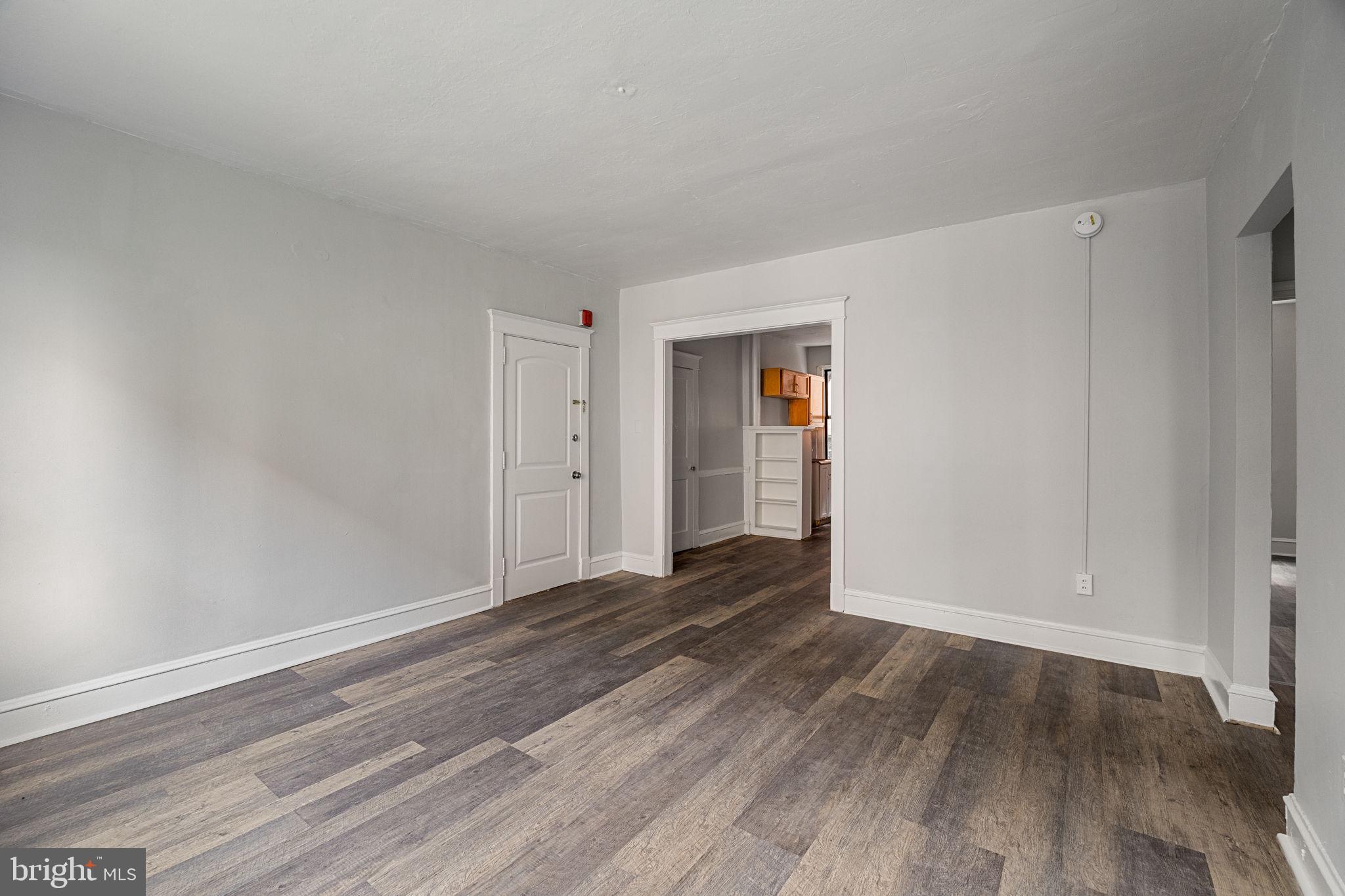 0 Garrett Road, Unit E201 Upper Darby, PA 19082 - Photo 8 of 19 a view of an empty room with wooden floor