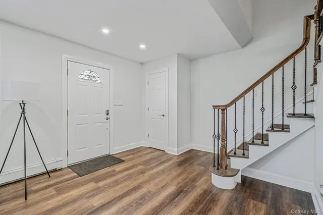 a view of entryway with wooden floor